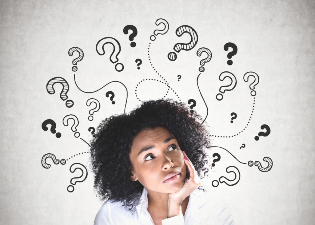Woman with question marks above her head