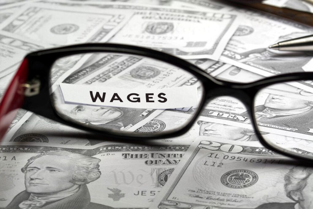 money glasses and wage