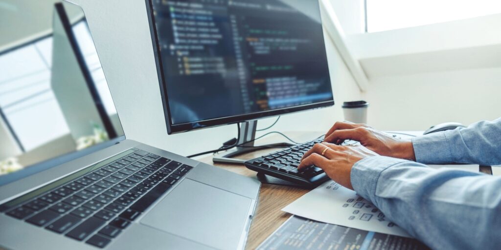 a person typing on a computer