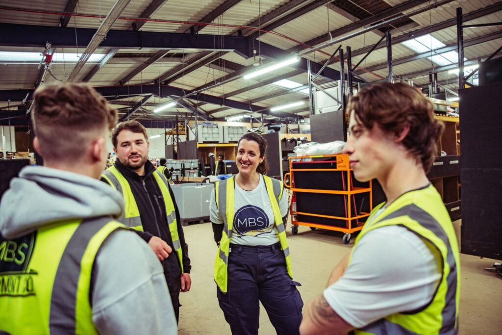 Level 5 Operations Manager at work with team