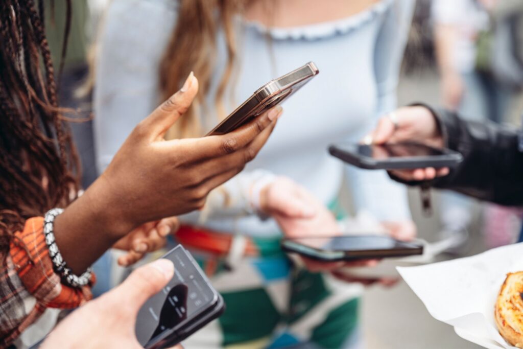 Girls using social media on phones