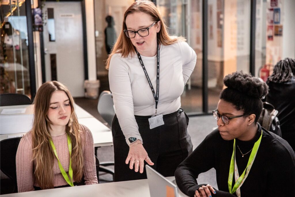 Teaching Assistant apprentice helping students