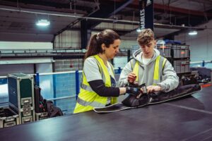 Screen Lighting Technician mentoring apprentice
