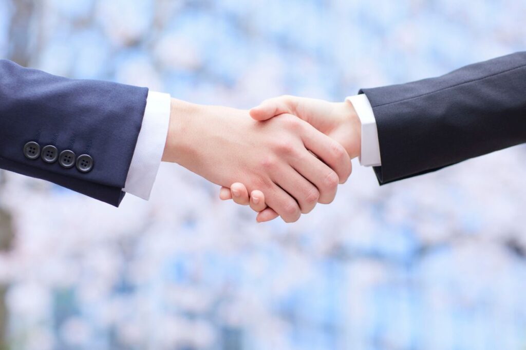 Career promotion - handshake between employer and employee