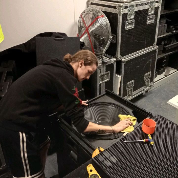 George Cheeseman at work, cleaning speaker system